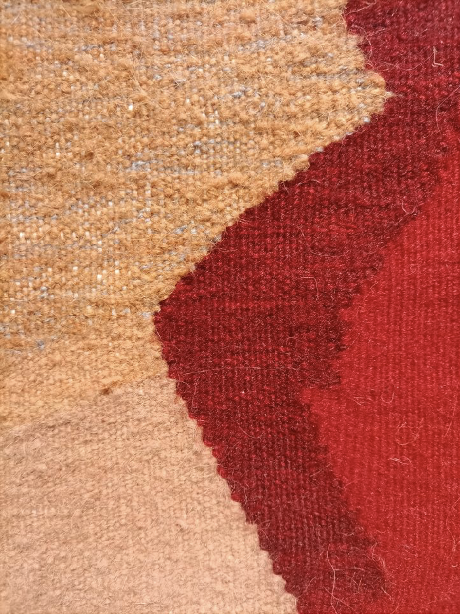 close-up picture of a woven surface in red and cream colors