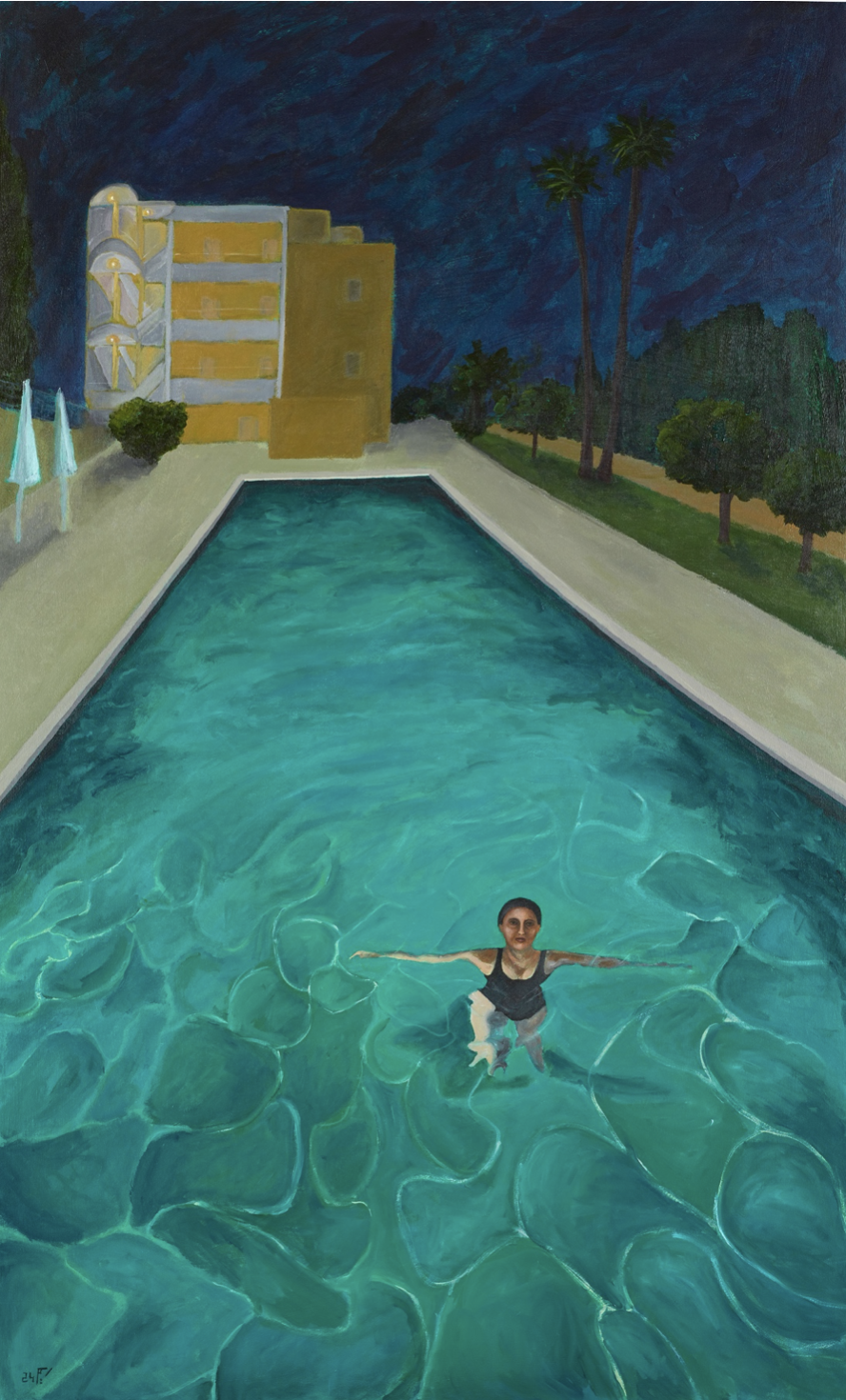 woman standing neck deep in a swimming pool at night