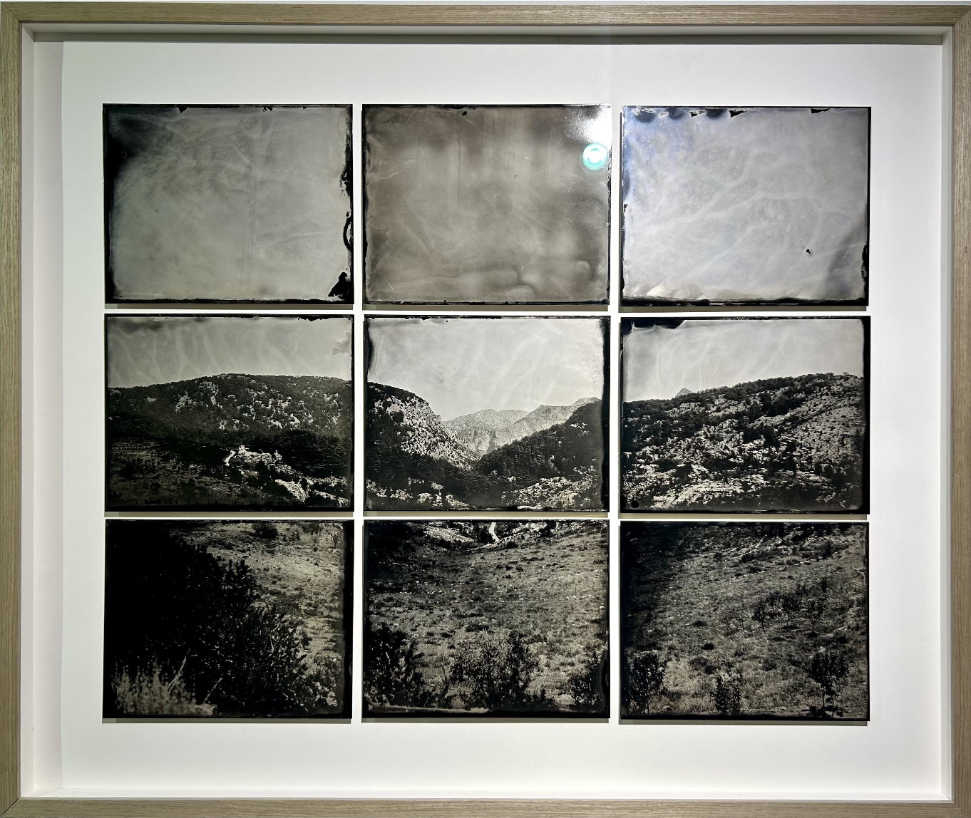 9 black and white photographs each showing one portion of the same mountain scene