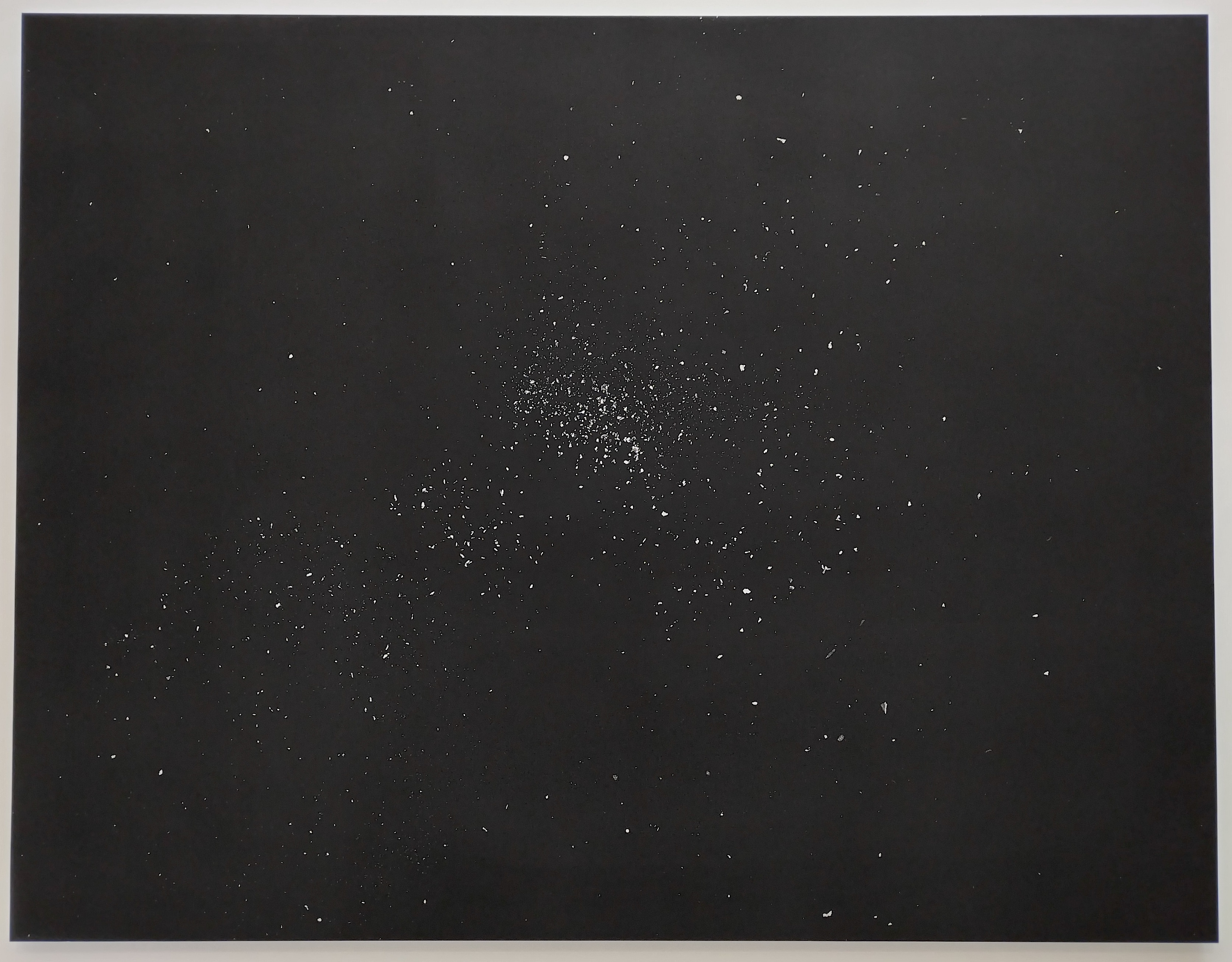 black surface sprinkled with silver specks